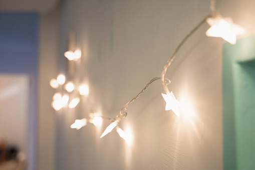 string of light bulbs on the wall