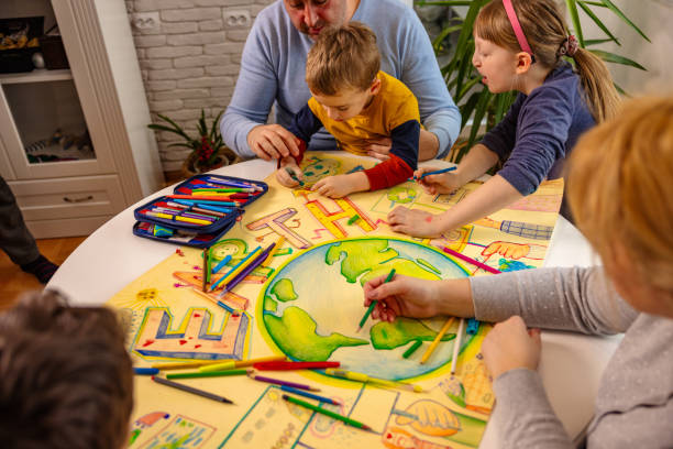 istock Curious kids with parents making art about sustainability 1371109648