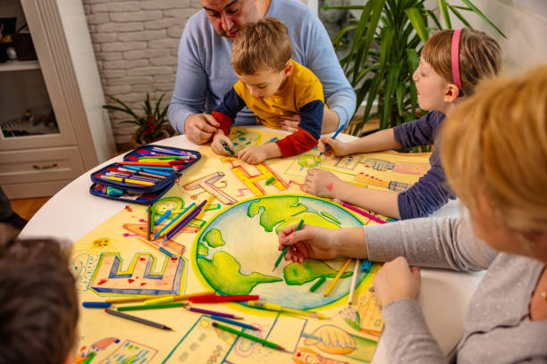 istock Creative kids with parents making art about sustainability 1371109758