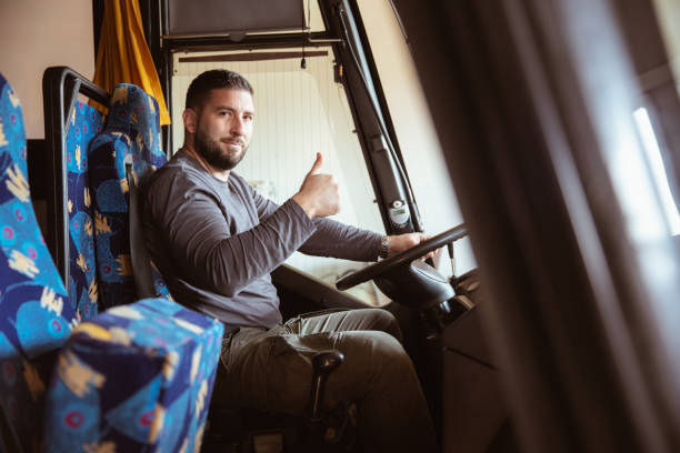 istock A bus driver posing for a photo in a bus 1371110259