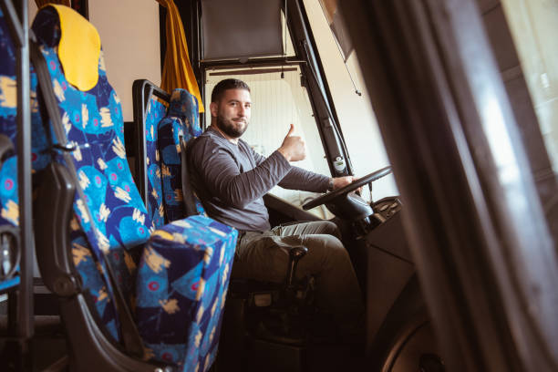 istock A bus driver posing for a photo in a bus 1371110365
