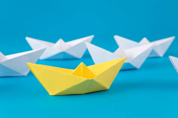 istock Leadership Concept with Paper Boats 1371111901