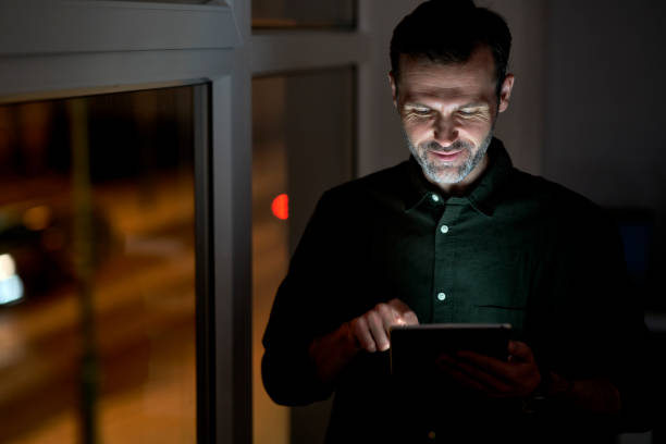 istock Adult caucasian man using digital tablet at the office 1371113083
