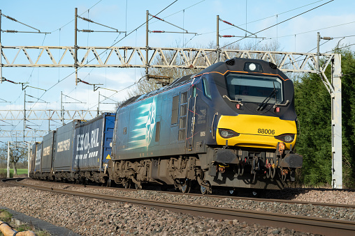 Staffordshire, England - A Direct Rail Services Class 88 Locomotive pulling a goods train along the West Coast Mainline.