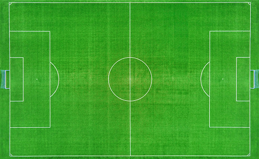 Top view of football ar soccer field with green grass, top view