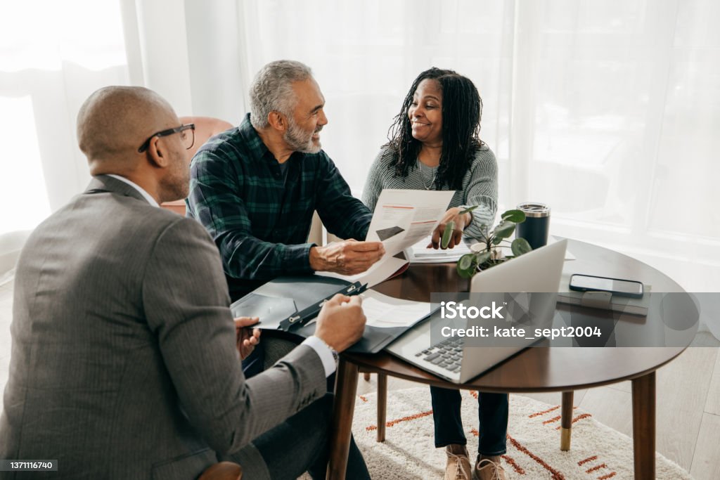 Should you rent or buy. Financial planning with professionals Financial Advisor Stock Photo