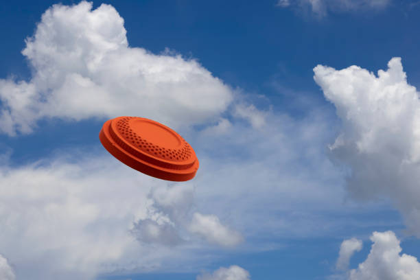 clay disc target shooting on the blue sky , clay pigeon targets game - disco ball fotos imagens e fotografias de stock