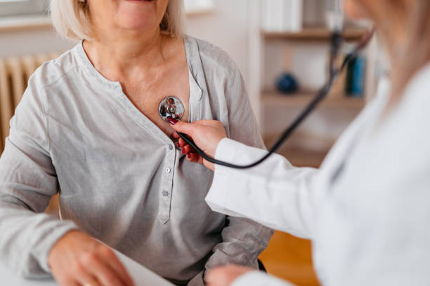 Doctor Auscultating A Senior Patient