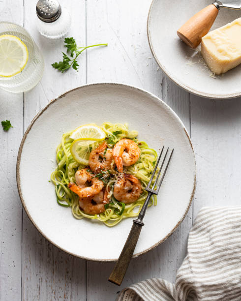 istock Zucchini pasta with shrimps on concrete background 1371121317