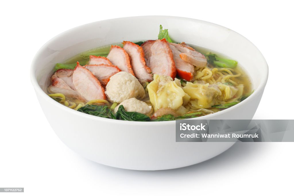 egg noodles with pork wonton soup or pork dumplings soup and vegetable isolated on white background with clipping path, Asian food style. Noodles Stock Photo