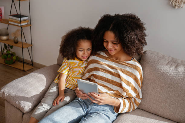 istock Older sister baby sits the younger one. 1371123194