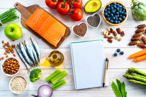 istock Healthy food rich in Omega-3 and blank note pad 1371123557
