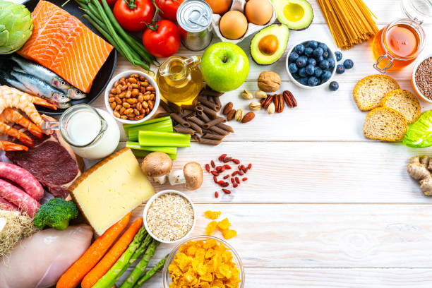 istock Large group of food on white table. Copy space 1371124471