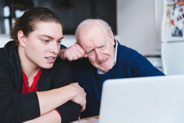 istock Son teaching his father how to invest online 1371125000