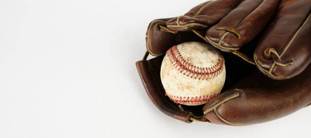 istock Old baseball background with ball and glove close up. 1371125963