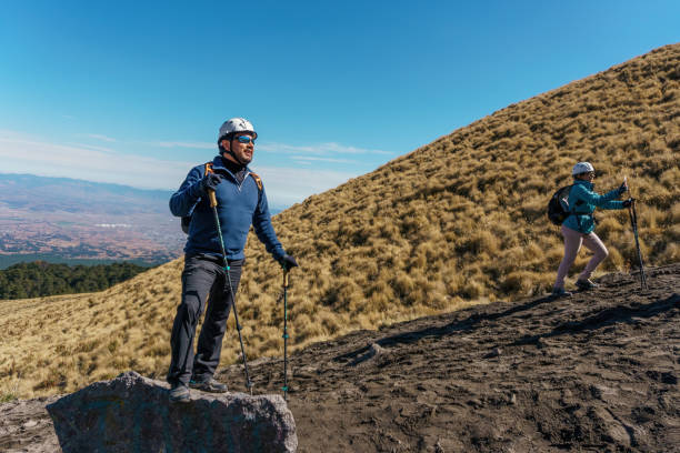 istock Two female hikers enjoying valley view 1371126170