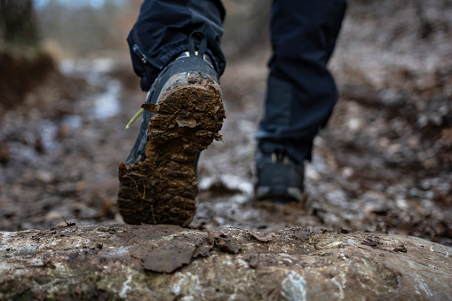 Close-up of man hikers shoes. Walk in the forest to climb the mountain