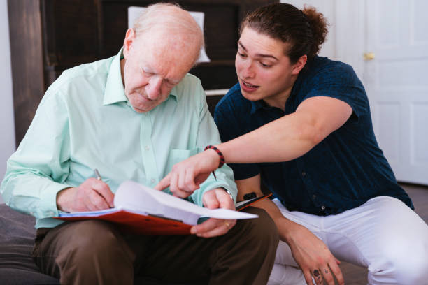 Assisting Grandfather filling the Paperwork