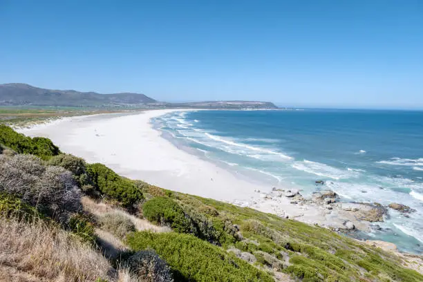 Photo of Beautiful white sand Noordhoek beach along Chapman's peak drive Cape Town South Africa
