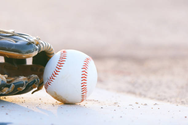istock Light baseball background with ball and glove close up. 1371127819