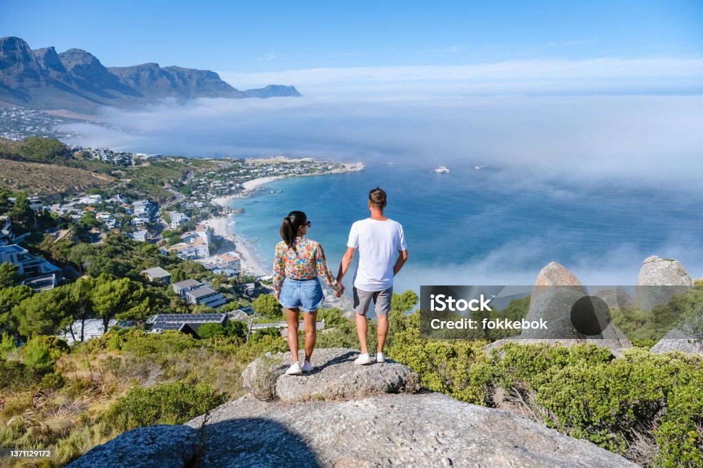 view from The Rock viewpoint in Cape Town over Campsbay, view over Camps Bay with fog over the ocean View from The Rock viewpoint in Cape Town over Campsbay, view over Camps Bay with fog over the ocean. fog coming in from ocean at Camps Bay Cape Town Cape Town Stock Photo
