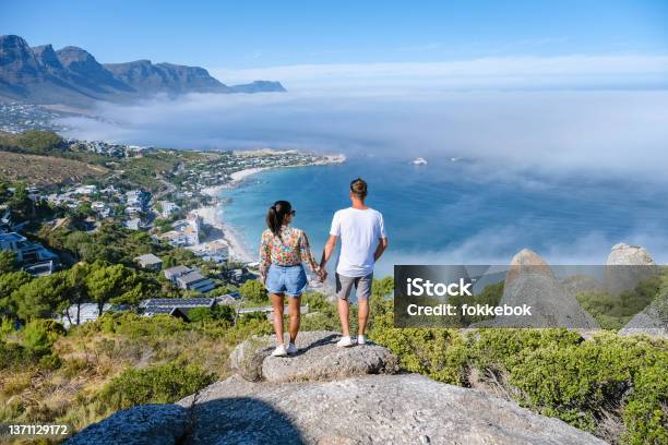 View From The Rock Viewpoint In Cape Town Over Campsbay View Over Camps Bay With Fog Over The Ocean Stock Photo - Download Image Now