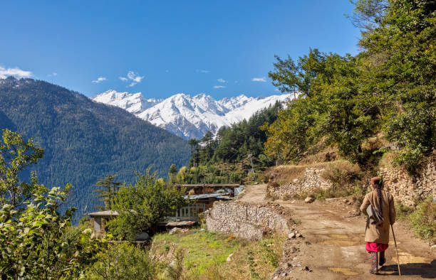 Scenic village road with Himalaya mountain snow peaks at Kalpa Himachal Pradesh, India stock photo
