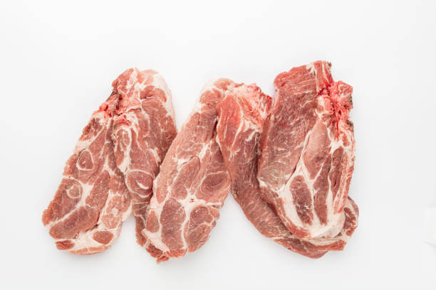 Sliced raw pork meat isolated on white background.