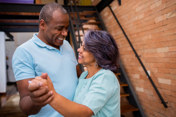 istock Mature couple dancing at home 1371131926