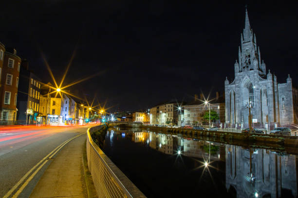 Cork City, County Cork, Ireland - Oct 25, 2021: View of Cork City Center and River Lee at night