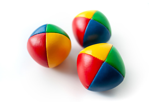 Three colorful juggling balls isolated on white background