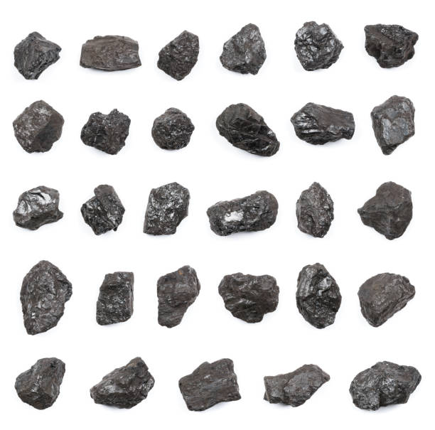 istock Anthracite hard stone coal lumps isolated on white background top view 1371135454