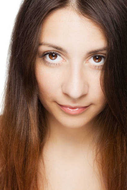 istock brunette girl looking at camera portrait 1371136081