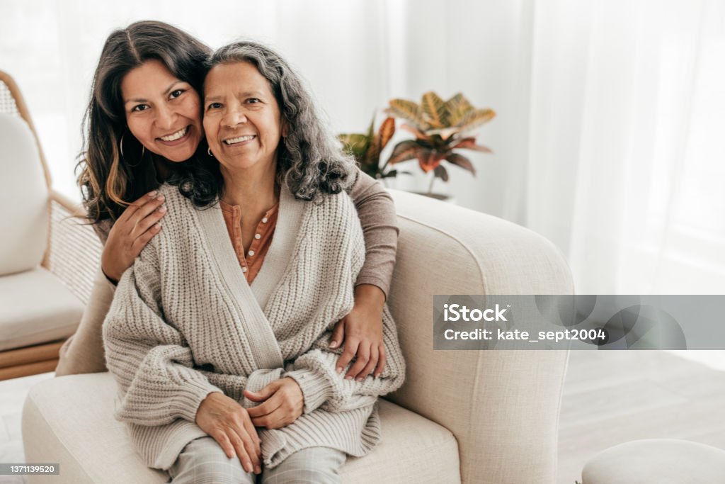 In-Home Care For Seniors Adult daughter caring for Elderly Parent Senior Adult Stock Photo