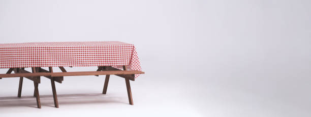 Picnic table and red checkered tablecloth with food and drink for outdoor party. Isolated white background. Wooden party table with foods and BBQ grills stove for summer picnics activities. Isolate. Picnic table and red checkered tablecloth with food and drink for outdoor party. Isolated white background. Wooden party table with foods and BBQ grills stove for summer picnics activities. Isolate. picnic table stock pictures, royalty-free photos & images