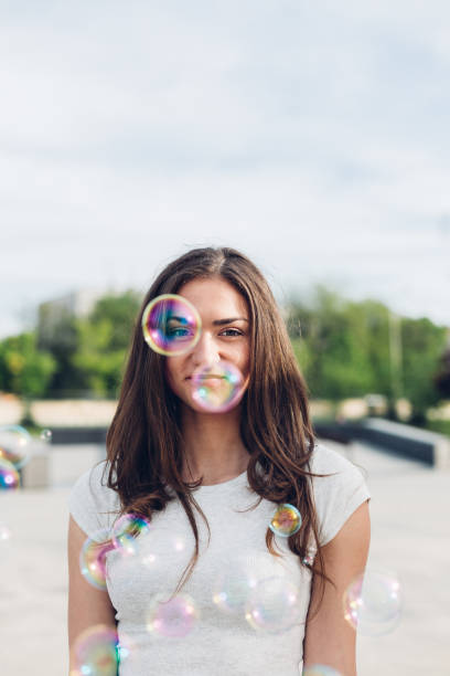 istock Girl Blowing Bubble 1371144408