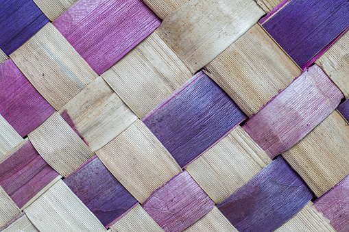 Extreme close-up of basket made of natural material. Handmade basket weaving.