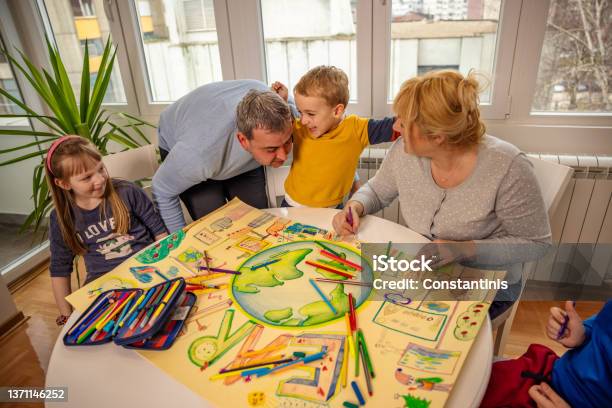 Cute Son Kissing His Parents During Art Class Int Heir Home Stock Photo - Download Image Now
