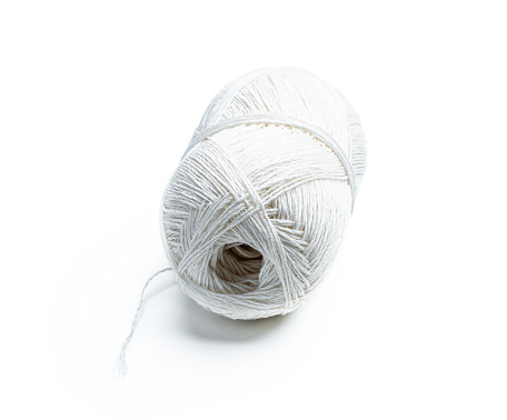 Skein  of white linen cord isolated on white