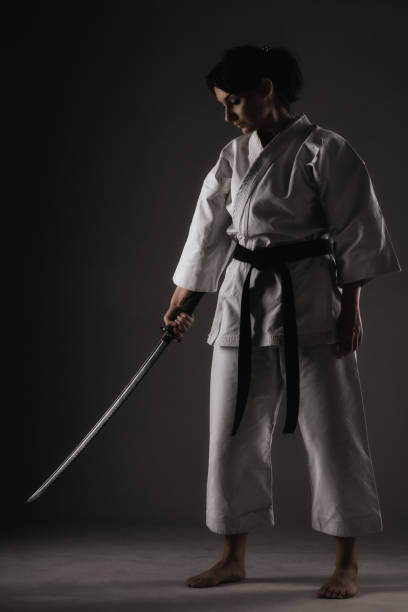 istock karate girl holding a sword 1371148194