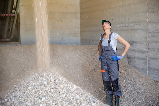 Adult Woman Working in Quartz Ore Processing Plant.