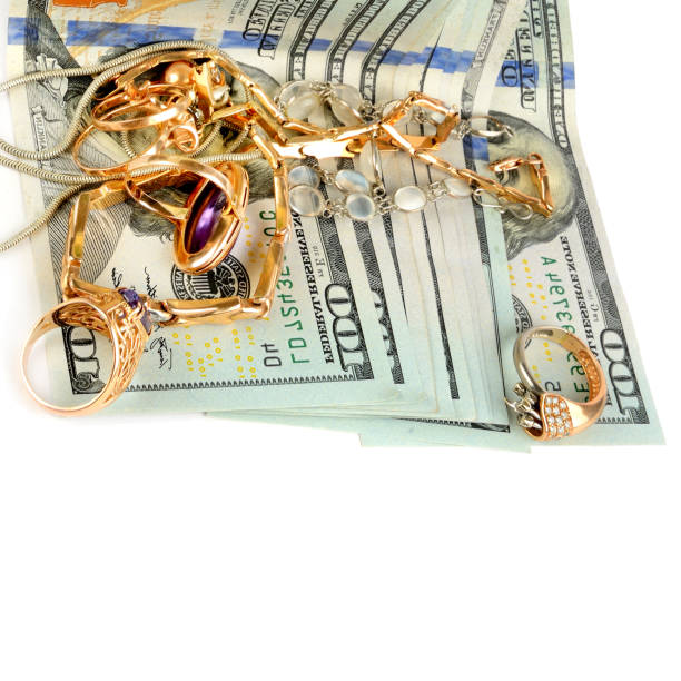 istock US dollars and jewelry isolated on white background. Free space for text. 1371149866