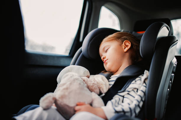 istock Little Girl Sleeping While Traveling by Car 1371149928
