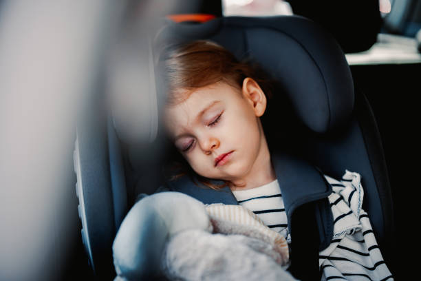 istock Little Girl Sleeping While Traveling by Car 1371149930
