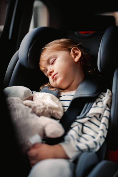 istock Little Girl Sleeping While Traveling by Car 1371149932