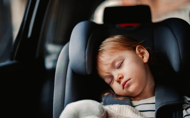 istock Little Girl Sleeping While Traveling by Car 1371149933