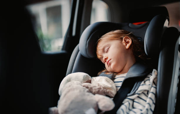 istock Little Girl Sleeping While Traveling by Car 1371149934