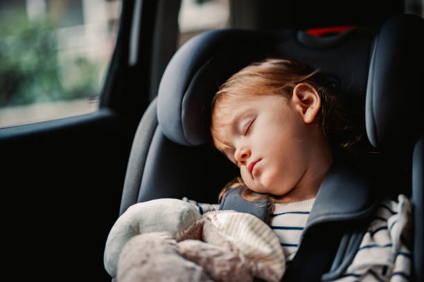 istock Little Girl Sleeping While Traveling by Car 1371149937