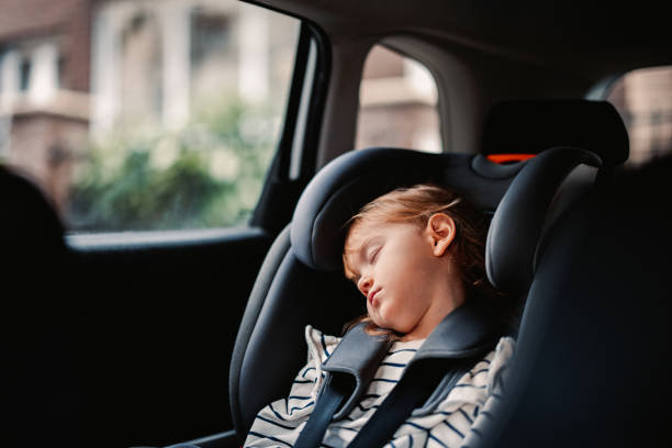 istock Little Girl Napping While Traveling by Car 1371149940