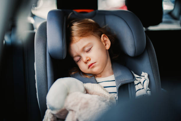istock Little Girl Sleeping While Traveling by Car 1371149984
